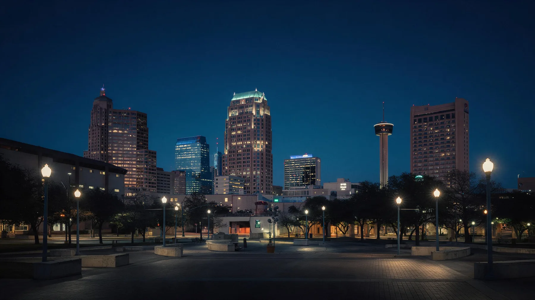 San Antonio, Texas downtown skyline at blue hour seen across a lit plaza